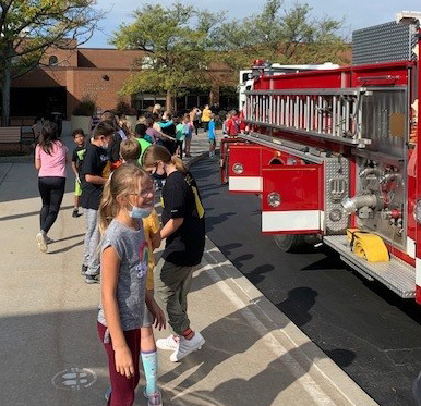 Students check out a fire truck outside Silver Creek Elementary