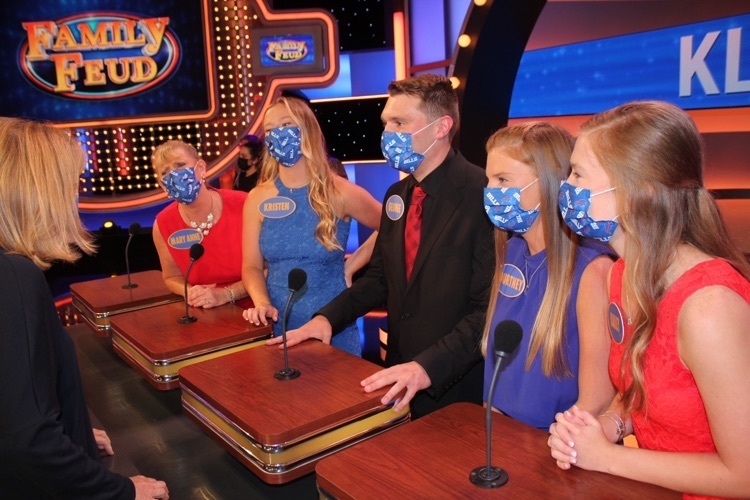 Kline family in masks on Family Feud