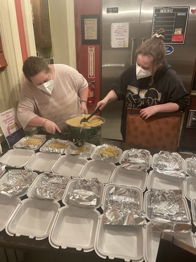 Students plate food at Kevin Guest House 